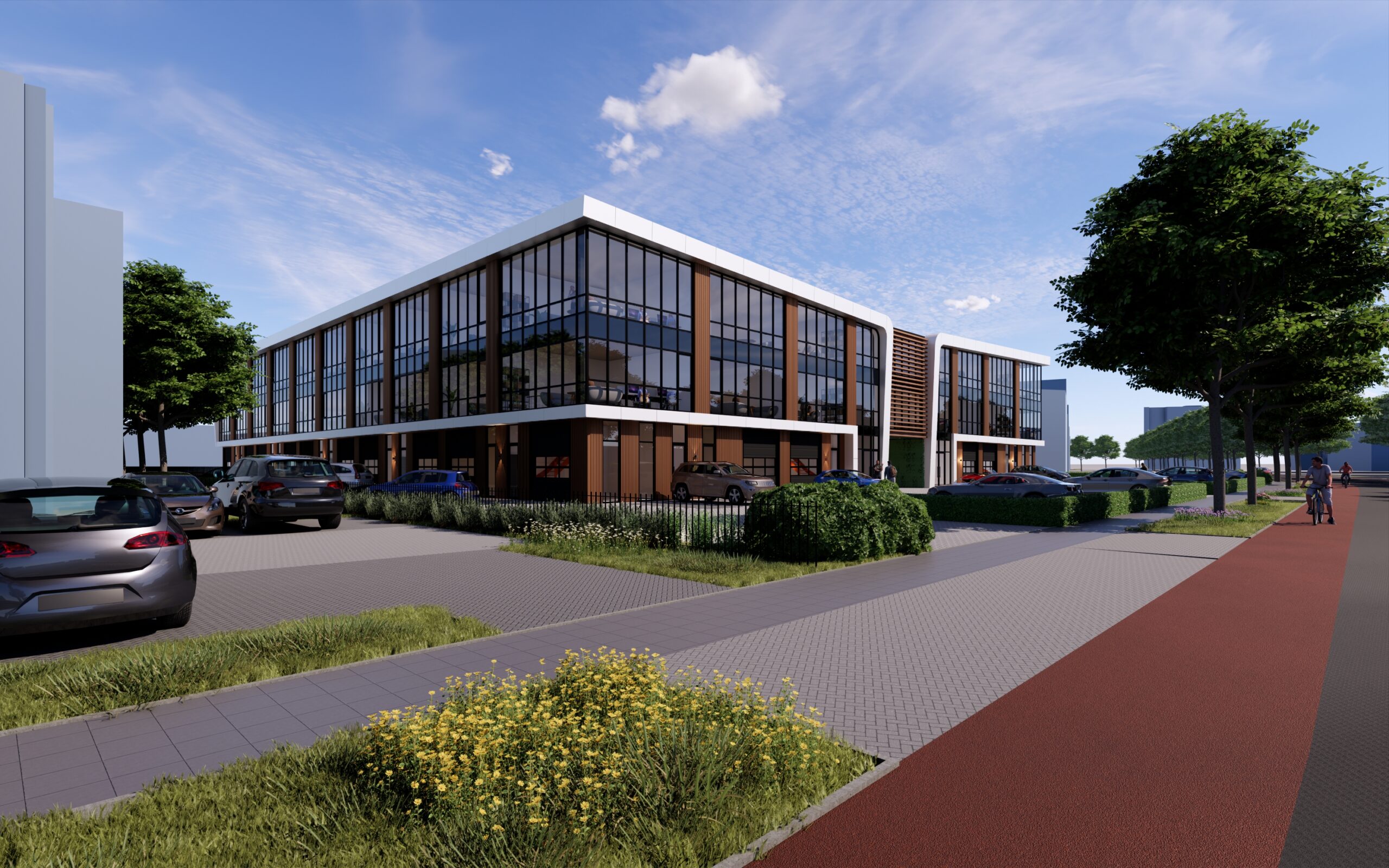 Voorzijde van een representatief bedrijfspand in Eindhoven met moderne architectuur, veel glas en een verzorgde groene omgeving.