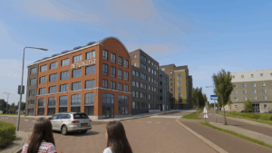 Impressie van het appartementencomplex Tijdgeest in Zaandam met warme verlichting, uitnodigende entree en moderne uitstraling – een kansrijk appartement te koop in Zaandam.