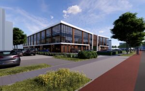 Bedrijfspand in Eindhoven gezien vanaf het fietspad bij de rotonde, met moderne architectuur en groene aanleg.